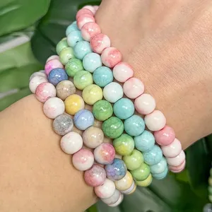 Close-up view of vibrant crackle texture painted glass round beads for DIY bracelet jewelry