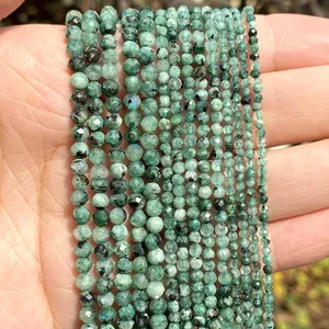 High-quality faceted green natural stone beads shown in 2mm 3mm and 4mm sizes on palm