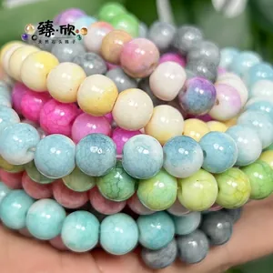 Macro detail of colorful cracked texture round glass beads for DIY jewelry making