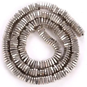 Macro detail of silver electroplated hematite triangle spacer beads for DIY jewelry