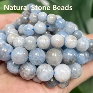 Close-up of natural light blue aquamarine round beads for DIY jewelry making