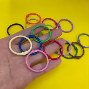 Close-up of colorful 30mm iron baked paint loose-leaf binder rings held in hand