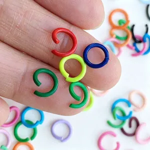 Macro shot of colorful painted iron jump rings for DIY crafts and jewelry making