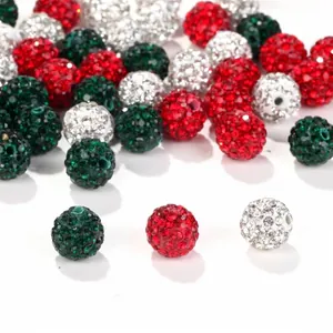 Close-up of 10mm red, green, and white rhinestone Shamballa beads for DIY jewelry.