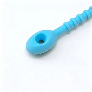Detailed macro view of a durable thick blue silicone cable tie with a fastening hole