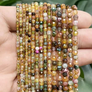 Detail view of multi-color faceted dragon vein agate round beads for DIY jewelry crafting
