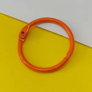 Detail view of an orange 30mm painted metal binder ring for DIY projects and keychains
