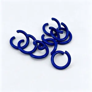Detailed view of blue 1.2x8mm baked lacquer iron open jump rings for DIY crafts