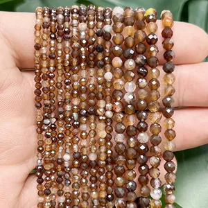 Detailed macro view of faceted multi-colored dragon vein agate beads for jewelry making