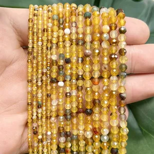 Detailed macro view of faceted yellow dragon vein agate beads for DIY handmade jewelry crafts