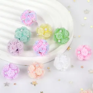 Detailed view of colorful pastel resin rose flower beads with pearl accents for DIY crafts