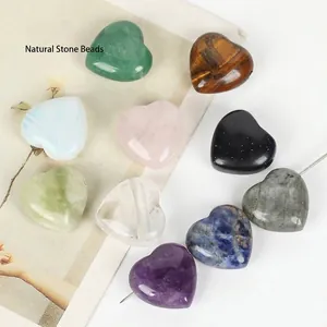 Close-up of heart-shaped natural gemstone beads with horizontal drill holes