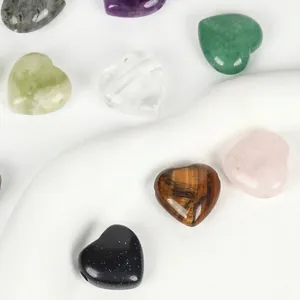 Close-up of polished heart-shaped natural stone beads showing unique textures and colors