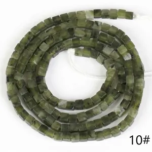 Close-up of 2x2mm green natural stone square spacer beads for jewelry making