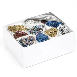 Detail shot of iridescent Silicon Carbide mineral specimens in a white square gift box
