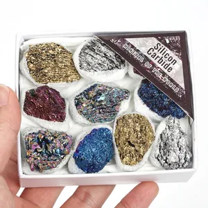 Detail view of a white gift box with various colorful Silicon Carbide raw mineral ores.