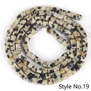 Close-up detail of 2x2mm dalmatian jasper square spacer beads for jewelry making