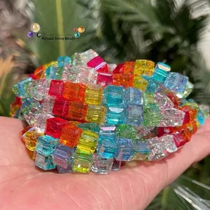 Macro detail of vibrant rainbow square faceted crystal glass beads for DIY jewelry making.