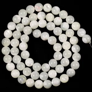 Detailed view of white natural trochus shell round beads for DIY jewelry making projects.