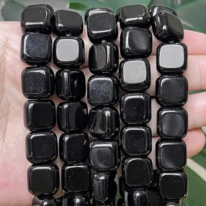 Detailed view of 14x14mm polished black onyx flat square beads for jewelry making
