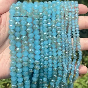 Macro view of faceted lake blue crystal glass beads for DIY jewelry making accessories.