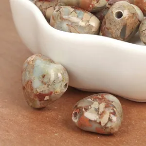 Detailed view of 15mm heart-shaped multi-color Imperial Turquoise stone beads for DIY jewelry