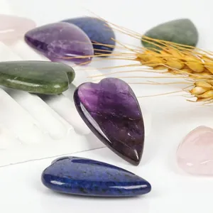 Macro view of heart-shaped natural stones including amethyst and lapis lazuli for DIY