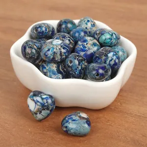 Close-up detail of 15mm heart-shaped blue imperial turquoise beads for DIY jewelry making.