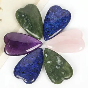 Detailed macro view of polished natural heart-shaped gemstones for jewelry DIY making.
