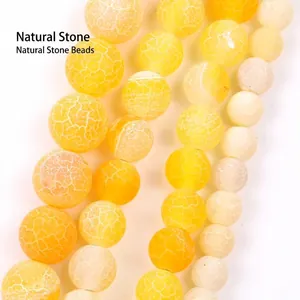 Detailed view of yellow dragon vein agate round loose beads for DIY jewelry making crafts