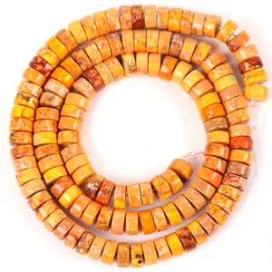 Detailed macro view of 6x3mm orange natural imperial stone disc beads for DIY jewelry making