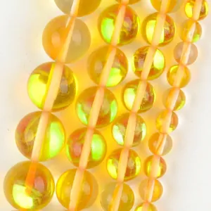 Macro view of translucent yellow natural stone round beads for jewelry making