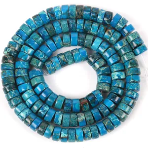 Close-up macro view of 6x3mm blue imperial jasper stone disc beads with natural textures
