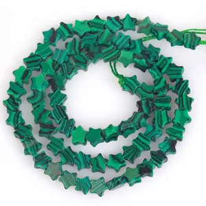Detail view of 6mm star-shaped natural green malachite loose beads for DIY jewelry