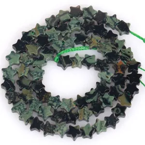 Macro detail of 6mm star-shaped green aventurine stone beads for jewelry making DIY