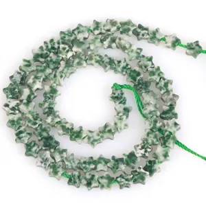Close-up of 6mm star-shaped green aventurine stone beads for DIY jewelry making.