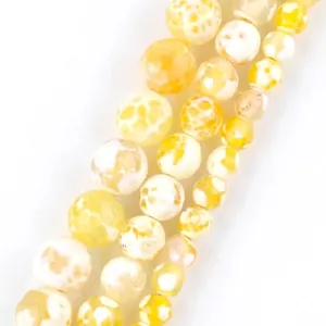 Detailed view of yellow dragon vein agate round beads for DIY jewelry making