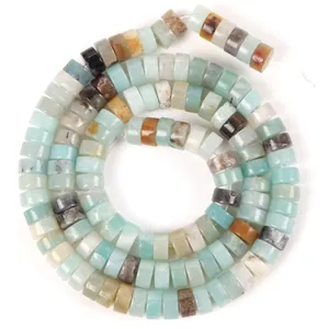 Detailed macro view of 6x3mm natural imperial stone spacer beads with marbled textures
