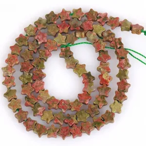Detailed view of 6mm star-shaped unakite natural stone beads for DIY jewelry