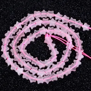 Detailed close-up of 6mm pink star-shaped natural stone loose beads for DIY jewelry