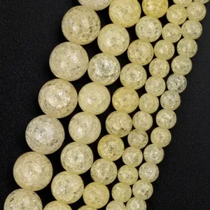 Macro detail of yellow natural stone beads with crackle texture for jewelry making.