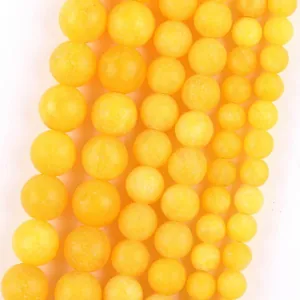 Detailed view of yellow natural stone round loose beads for DIY bracelet and necklace jewelry