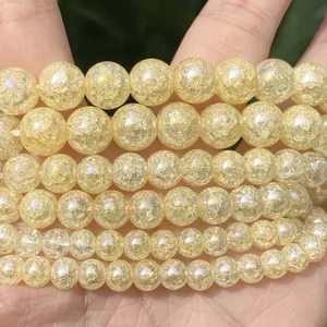 Detailed macro shot of translucent yellow cracked quartz round beads for DIY jewelry making