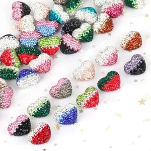 Close-up of colorful heart-shaped Shamballa beads with sparkling rhinestones
