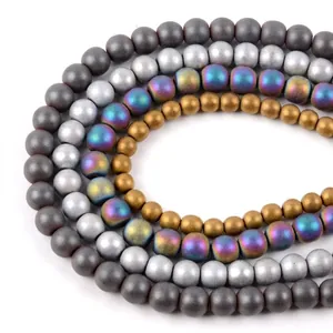 Macro view showing the matte texture of electroplated colorful hematite round loose beads