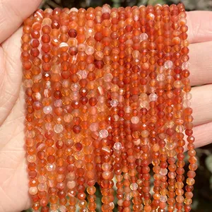 Detailed macro shot of faceted orange carnelian gemstone beads for DIY jewelry making