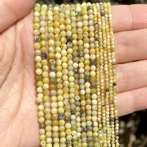 Close-up of faceted 2mm to 4mm yellow natural stone beads for DIY jewelry making