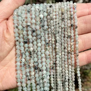 Detail view of faceted natural stone beads for DIY jewelry making in various sizes.
