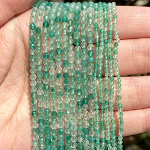 Close-up macro view of faceted 2/3/4mm green aventurine natural stone beads for DIY