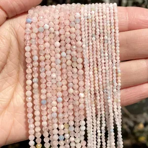 Close-up of 2mm faceted natural rose quartz stone beads for DIY jewelry making accessories.
